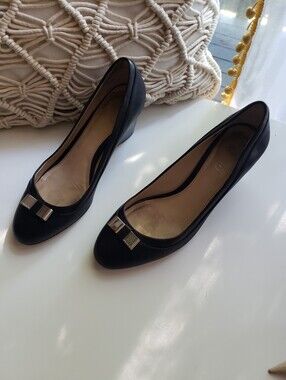 Coach Black Flats with Gold-Tone Bow Accent